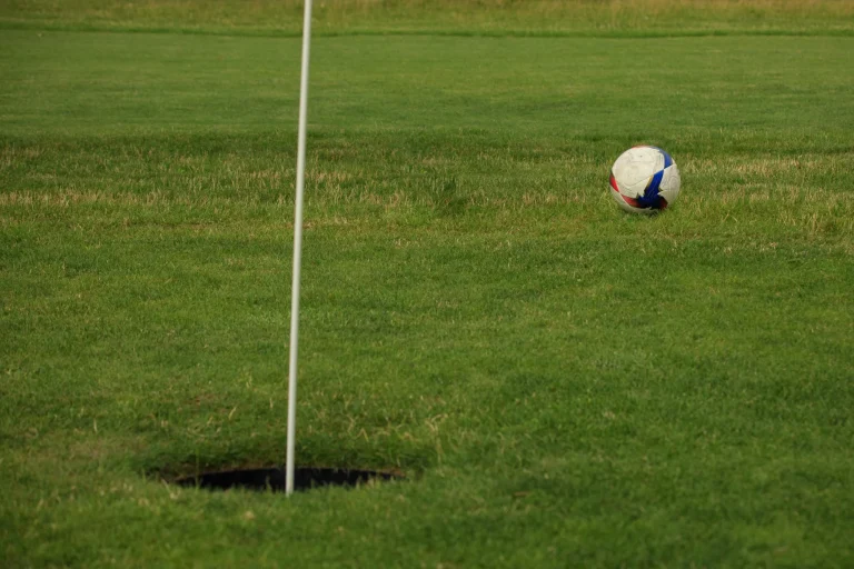 a modern simple gentleman's ball game on the golf course called footgolf