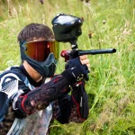 paintball shooter aiming the gun
