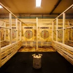Axe hitting the target at an axe throwing game